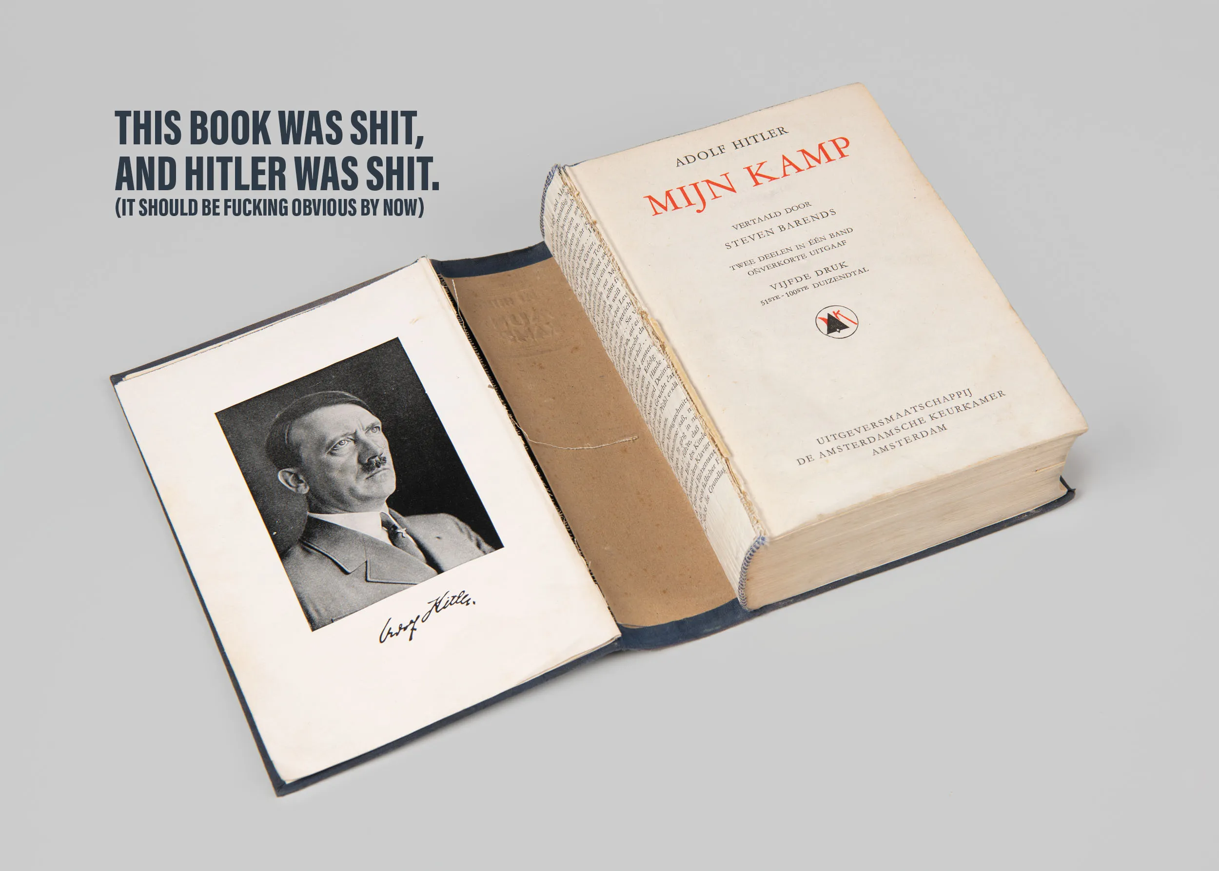 A photograph of an old, worn copy of Mein Kampf open to the first page. It is signed. In the upper-left of the photo it reads 'This book was shit, and Hitler was shit. (It should be fucking obvious by now)
