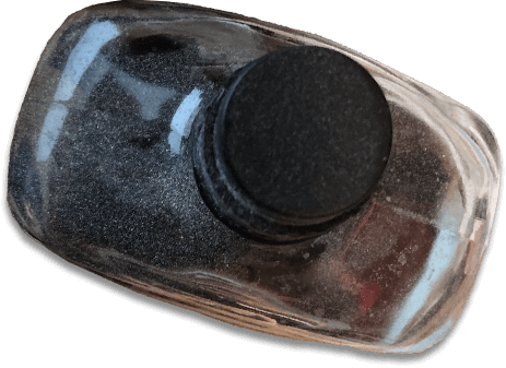 A dusty bottle of bourbon, viewed from above.